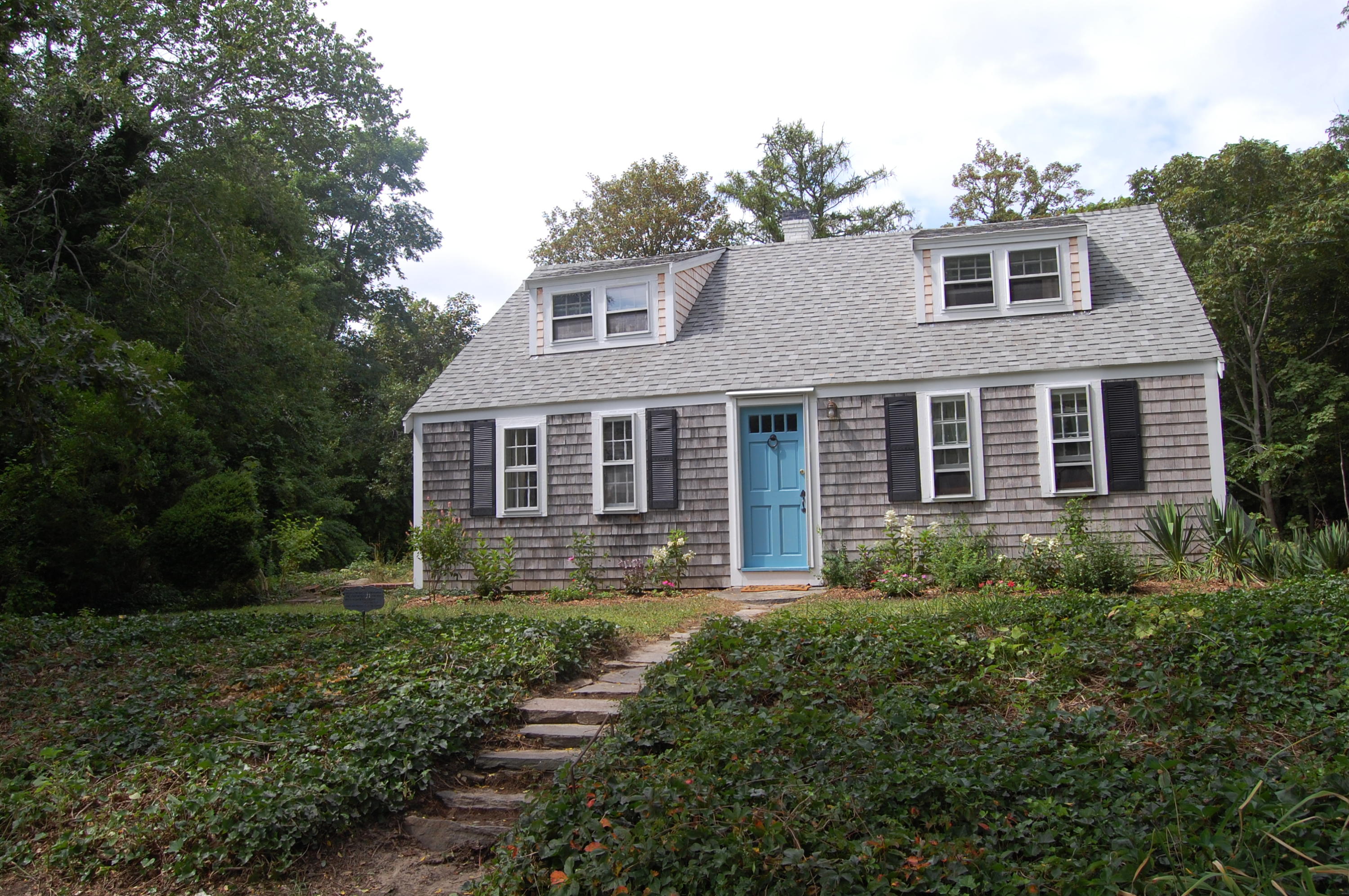 46 Namskaket Road Orleans, MA 02653 - Photo 3 of 35 a front view of a house with yard and green space