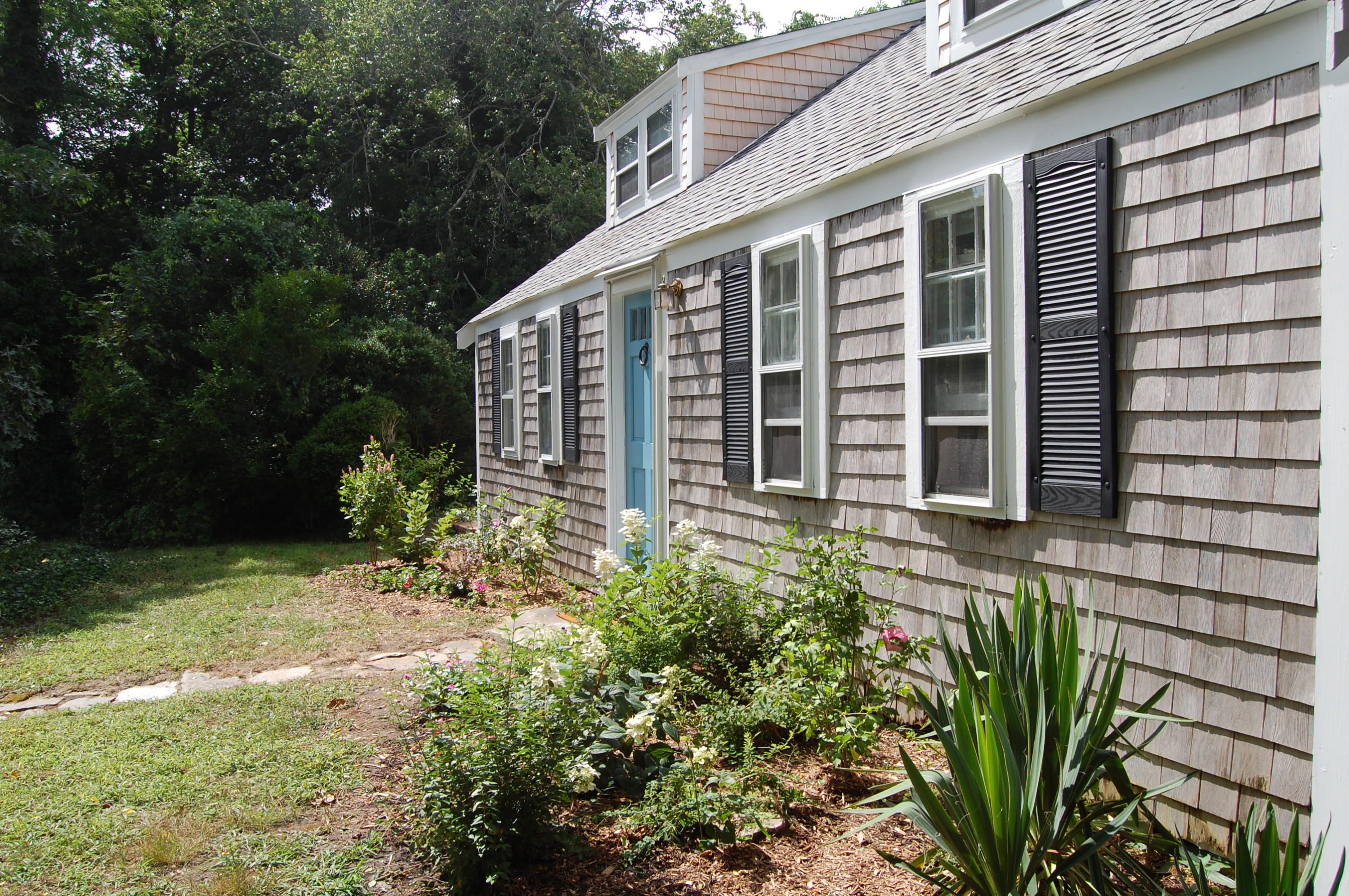 46 Namskaket Road Orleans, MA 02653 - Photo 35 of 35 a view of a house with backyard and garden