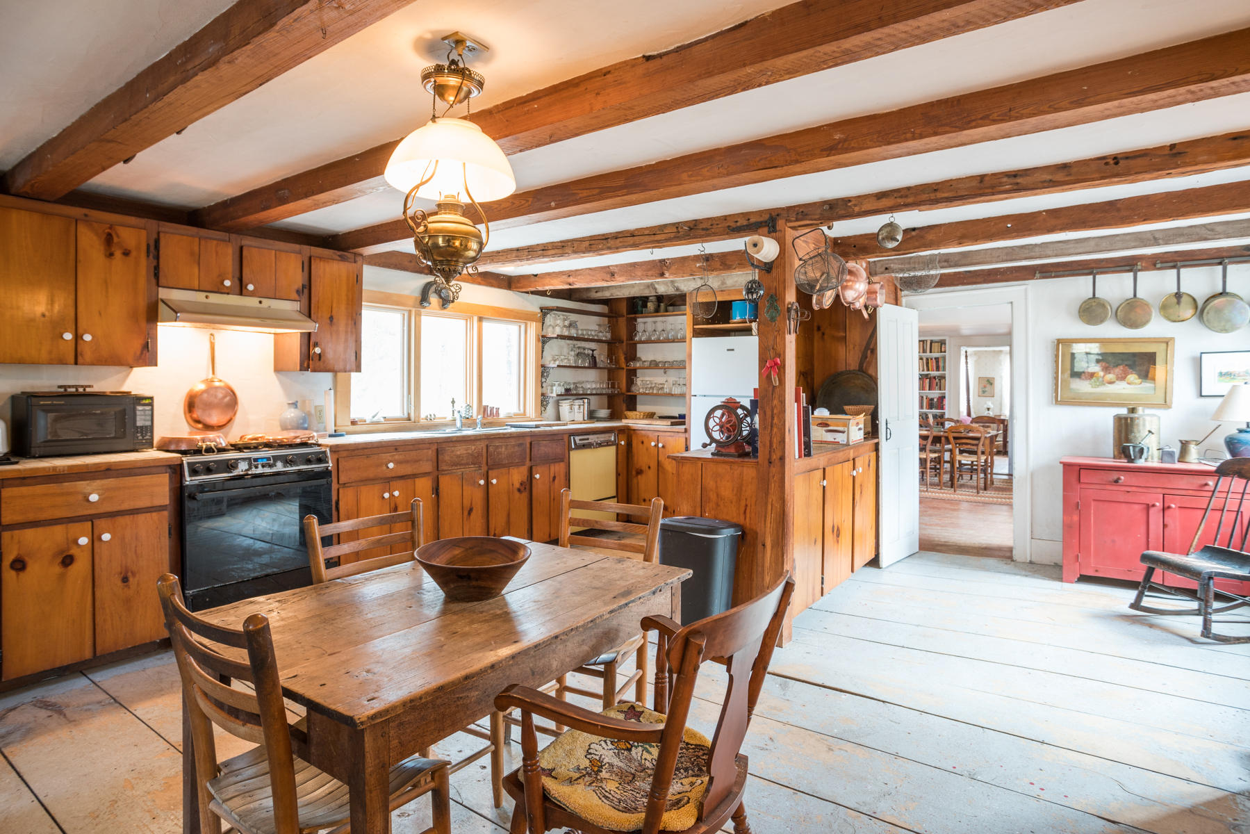 46 Namskaket Road Orleans, MA 02653 - Photo 5 of 35 a kitchen with a dining table and chairs