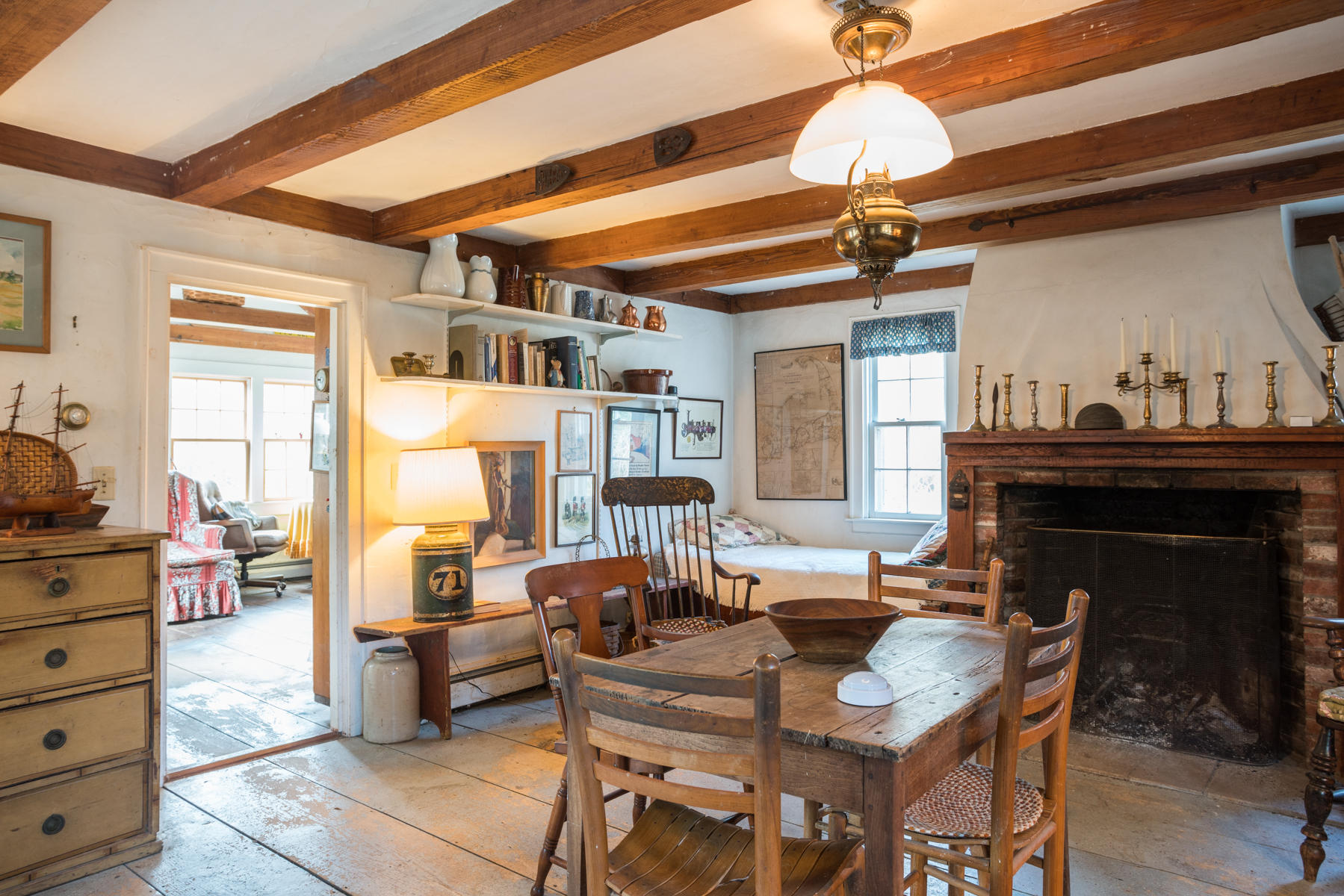 46 Namskaket Road Orleans, MA 02653 - Photo 6 of 35 a living room with furniture a fireplace and a chandelier