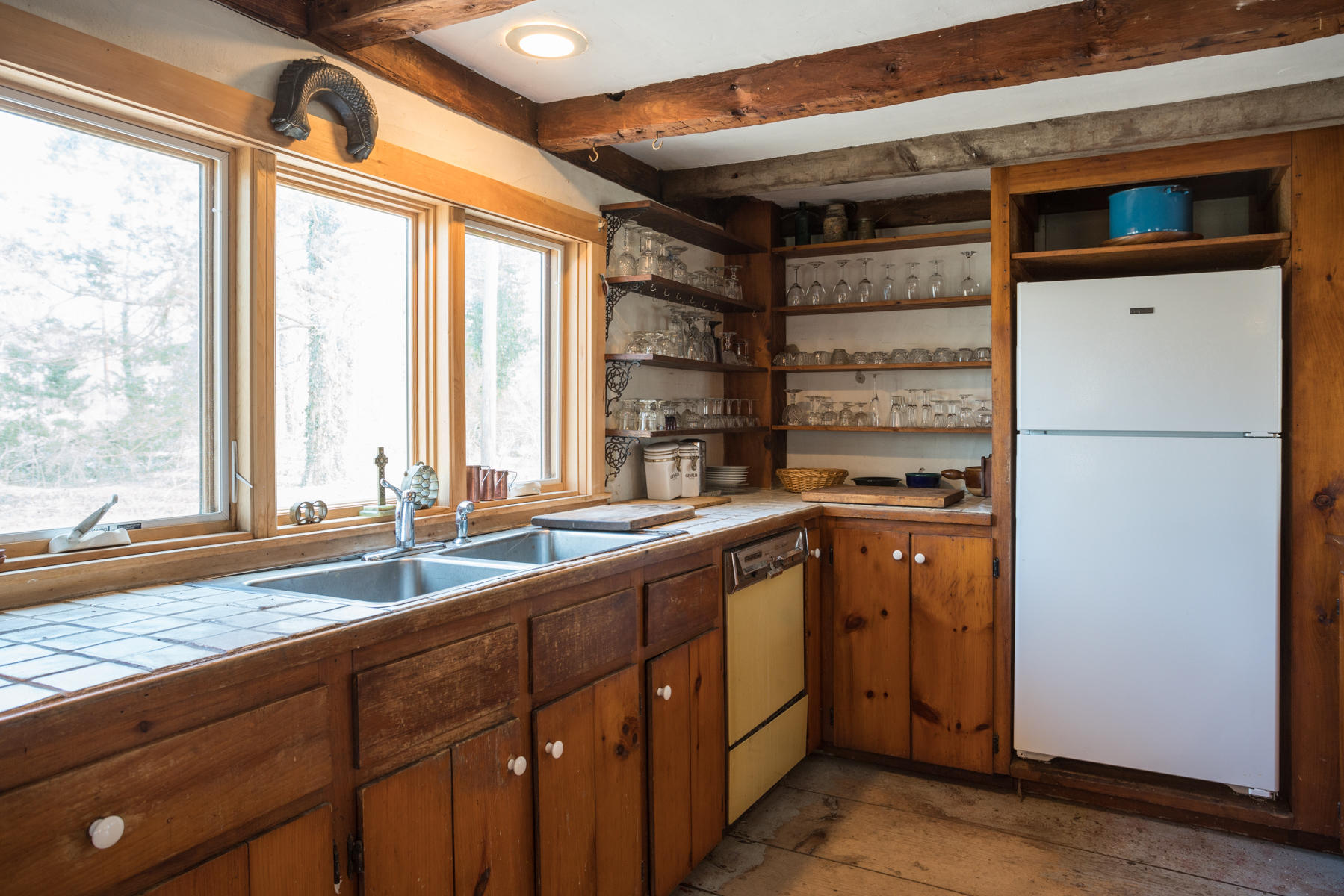 46 Namskaket Road Orleans, MA 02653 - Photo 7 of 35 a kitchen with a sink and a refrigerator
