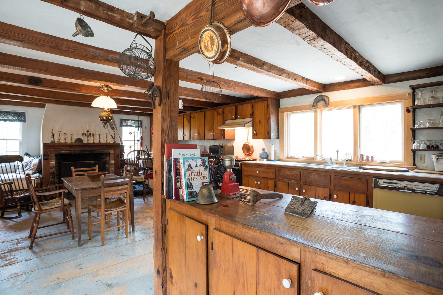 46 Namskaket Road Orleans, MA 02653 - Photo 8 of 35 a kitchen with lots of counter top space and dining table