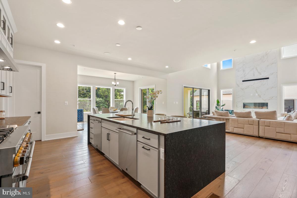 12321 Potomac Hunt Road North Potomac, MD 20878 - Photo 18 of 64 a kitchen with stainless steel appliances granite countertop a sink and a large window