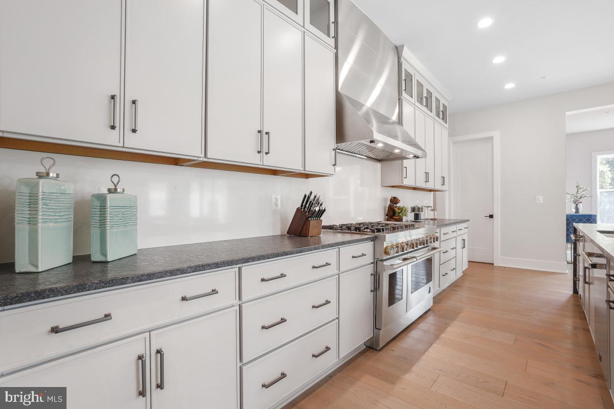 12321 Potomac Hunt Road North Potomac, MD 20878 - Photo 19 of 64 a kitchen with stainless steel appliances granite countertop white cabinets and a sink