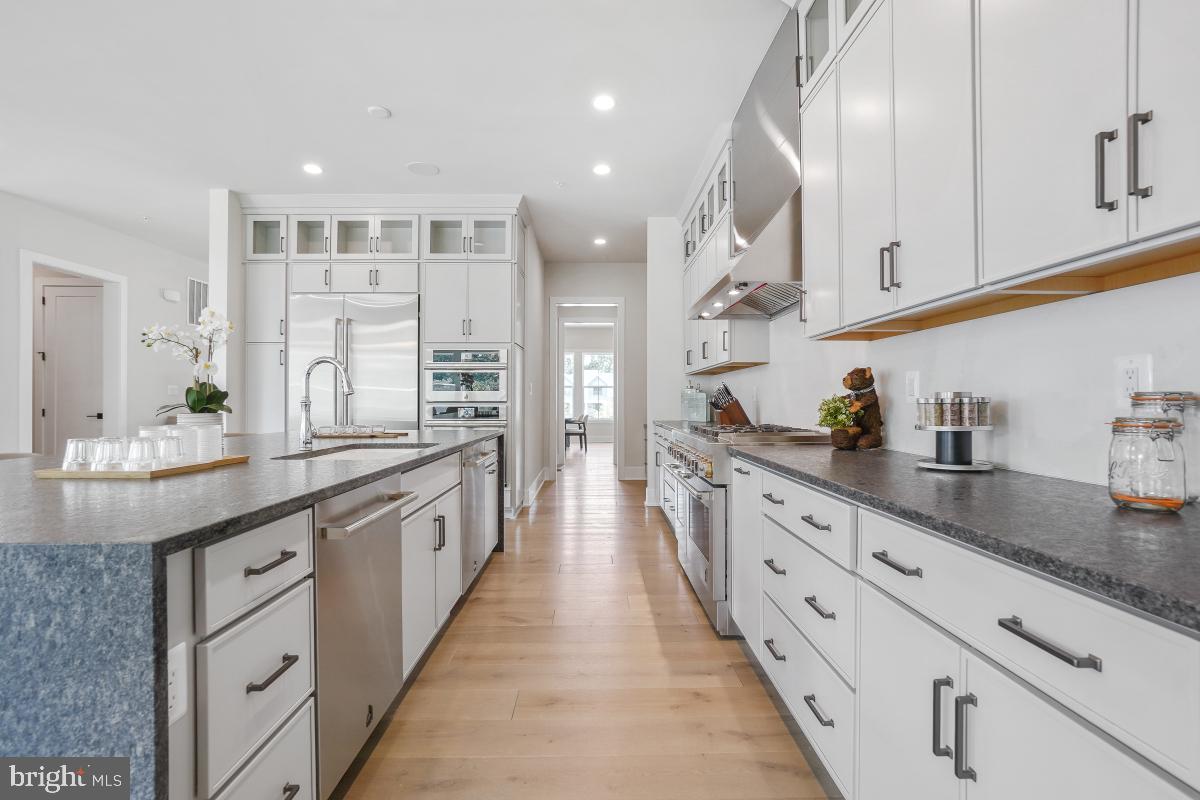 12321 Potomac Hunt Road North Potomac, MD 20878 - Photo 20 of 64 a large kitchen with stainless steel appliances lots of counter space and a sink