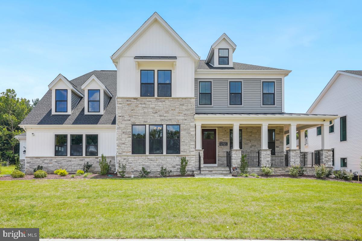 12321 Potomac Hunt Road North Potomac, MD 20878 - Photo 2 of 64 a front view of a house with a yard