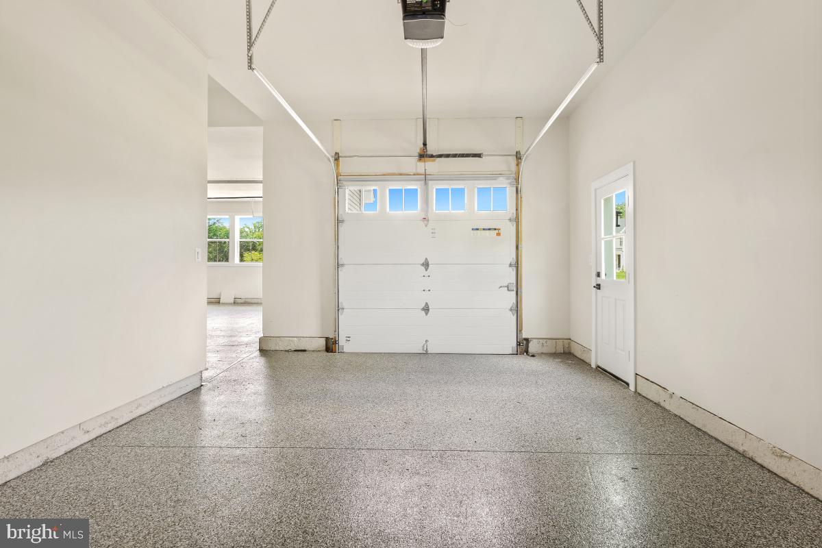 12321 Potomac Hunt Road North Potomac, MD 20878 - Photo 28 of 64 an empty room with chandelier fan and windows