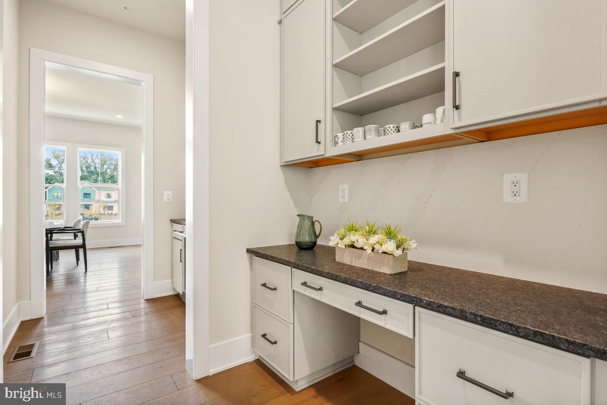 12321 Potomac Hunt Road North Potomac, MD 20878 - Photo 30 of 64 a kitchen with stainless steel appliances a sink and wooden floor