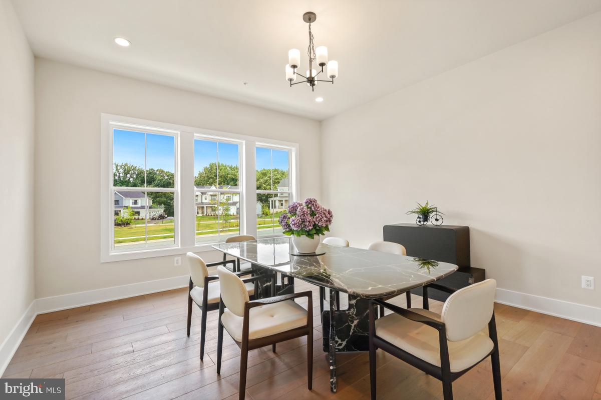 12321 Potomac Hunt Road North Potomac, MD 20878 - Photo 32 of 64 a view of a dining room with furniture and a window