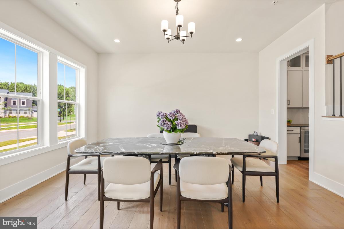 12321 Potomac Hunt Road North Potomac, MD 20878 - Photo 34 of 64 a view of a dining room with furniture and wooden floor