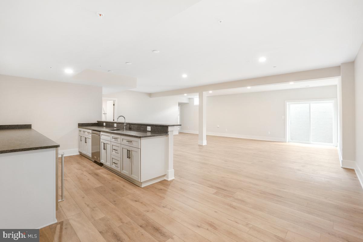 12321 Potomac Hunt Road North Potomac, MD 20878 - Photo 56 of 64 a kitchen with stainless steel appliances cabinets and wooden floor