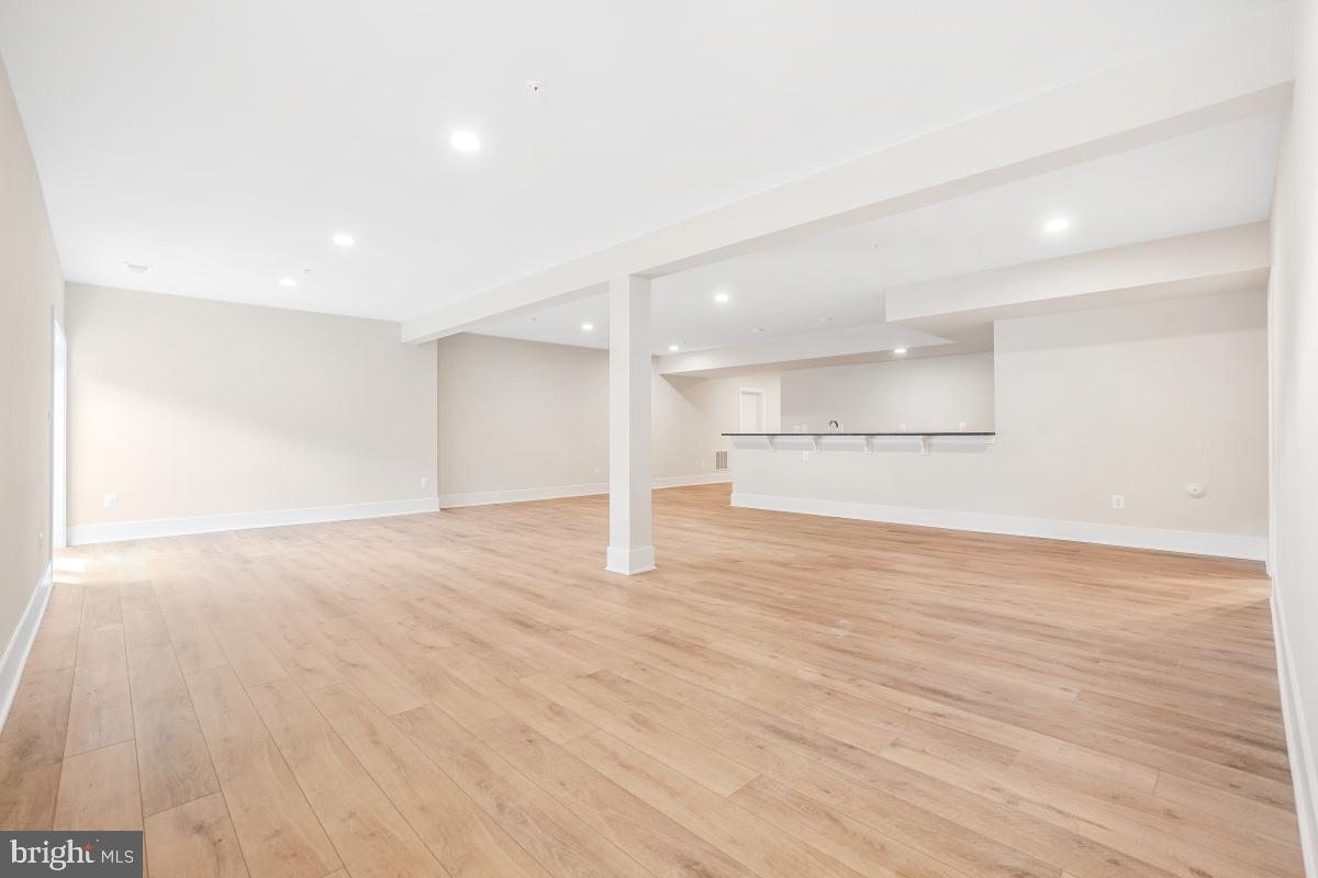 12321 Potomac Hunt Road North Potomac, MD 20878 - Photo 57 of 64 a view of empty room with wooden floor