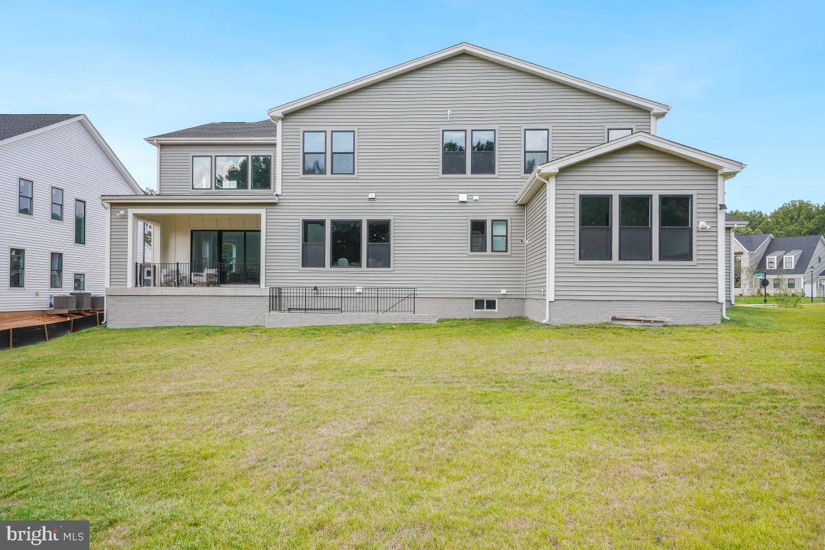 12321 Potomac Hunt Road North Potomac, MD 20878 - Photo 59 of 64 a front view of house with yard and swimming pool