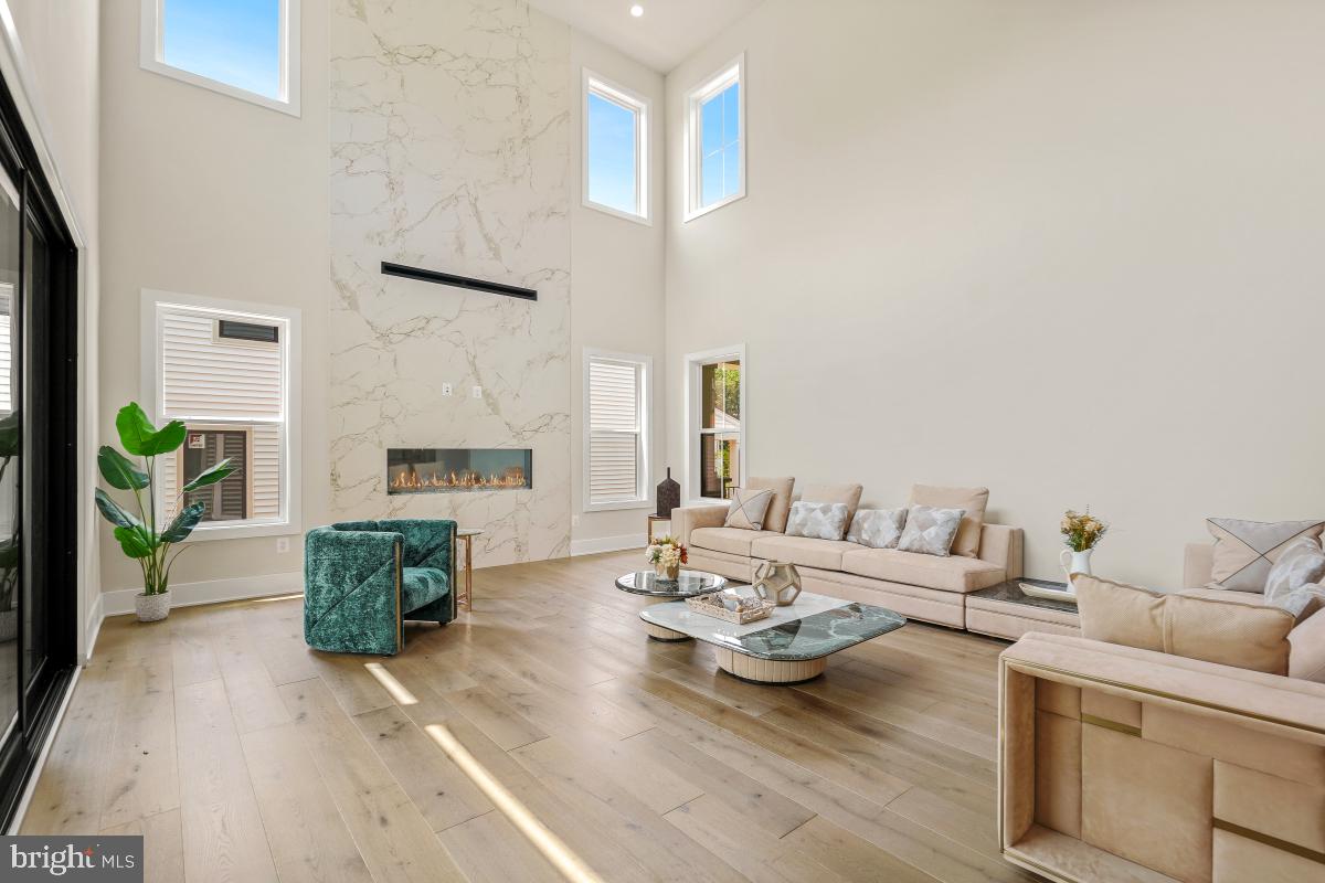 12321 Potomac Hunt Road North Potomac, MD 20878 - Photo 8 of 64 a living room with furniture and a flat screen tv