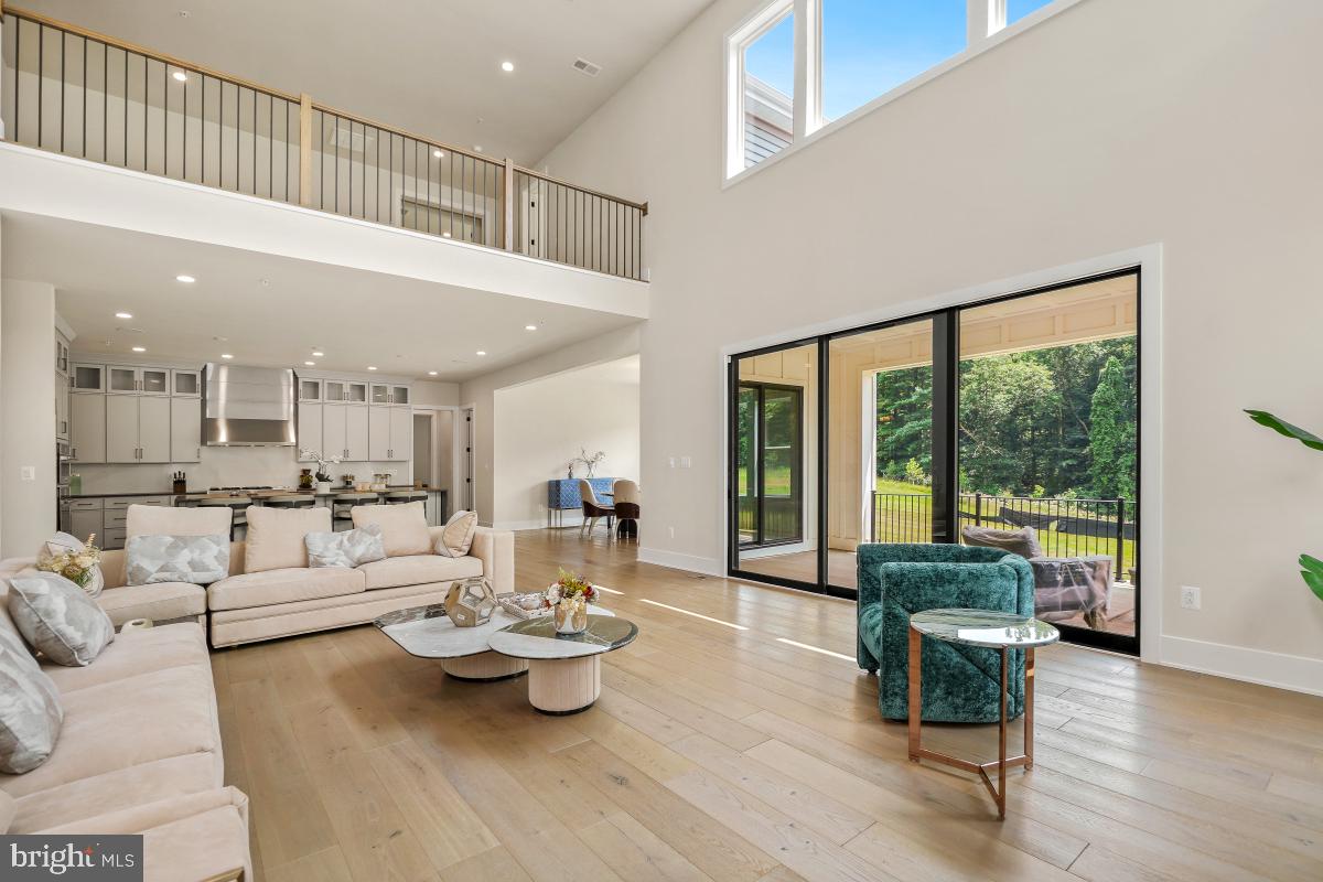12321 Potomac Hunt Road North Potomac, MD 20878 - Photo 10 of 64 a living room with furniture and a large window