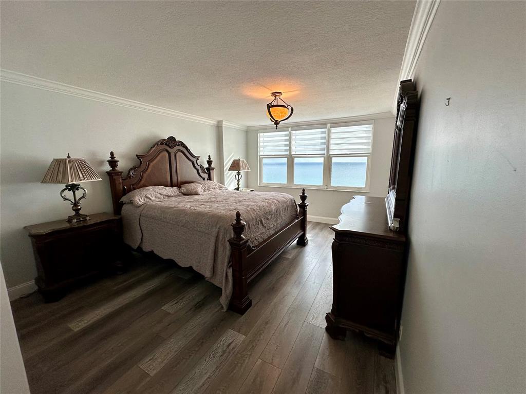 1012 North Ocean Boulevard, Unit 1206 Pompano Beach, FL 33062 - Photo 11 of 33 a bed room with a bed and a window
