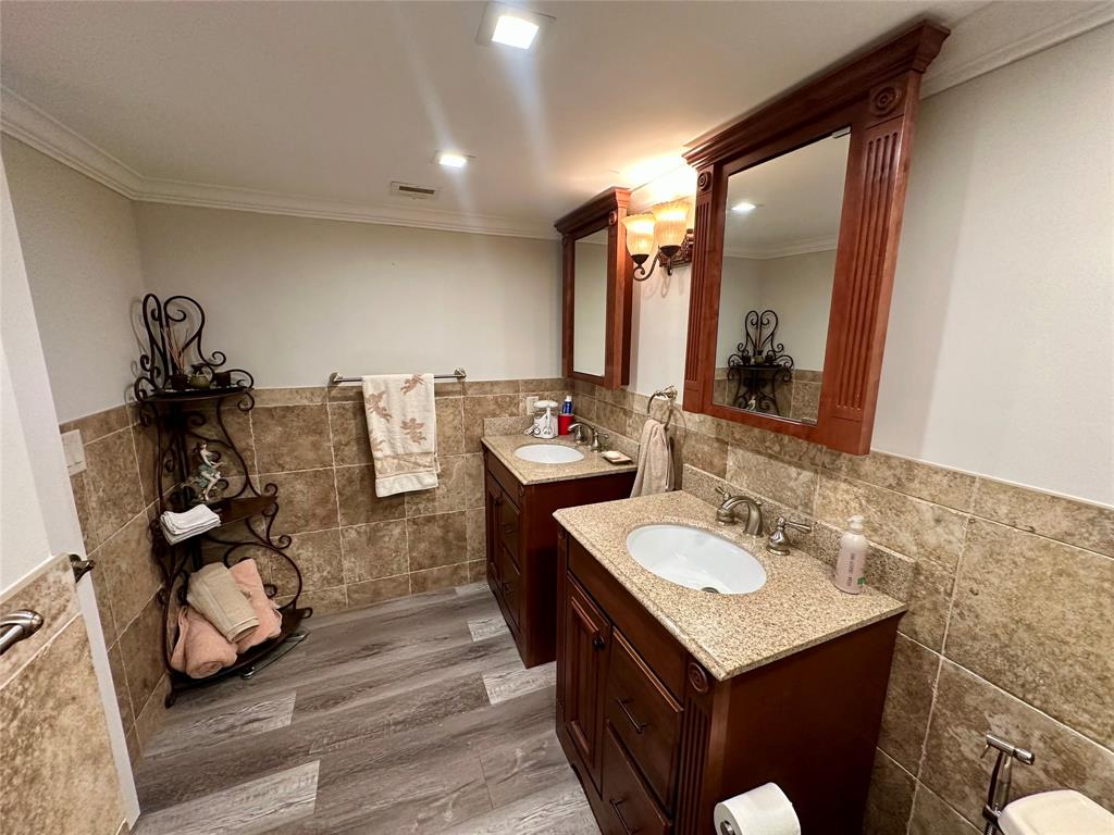1012 North Ocean Boulevard, Unit 1206 Pompano Beach, FL 33062 - Photo 12 of 33 a bathroom with a sink and a mirror