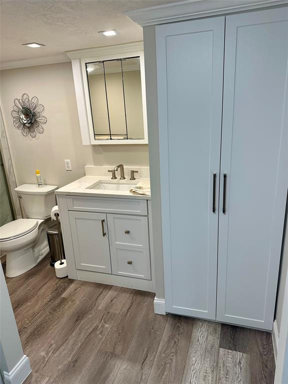 1012 North Ocean Boulevard, Unit 1206 Pompano Beach, FL 33062 - Photo 16 of 33 a bathroom with a sink a toilet and mirror