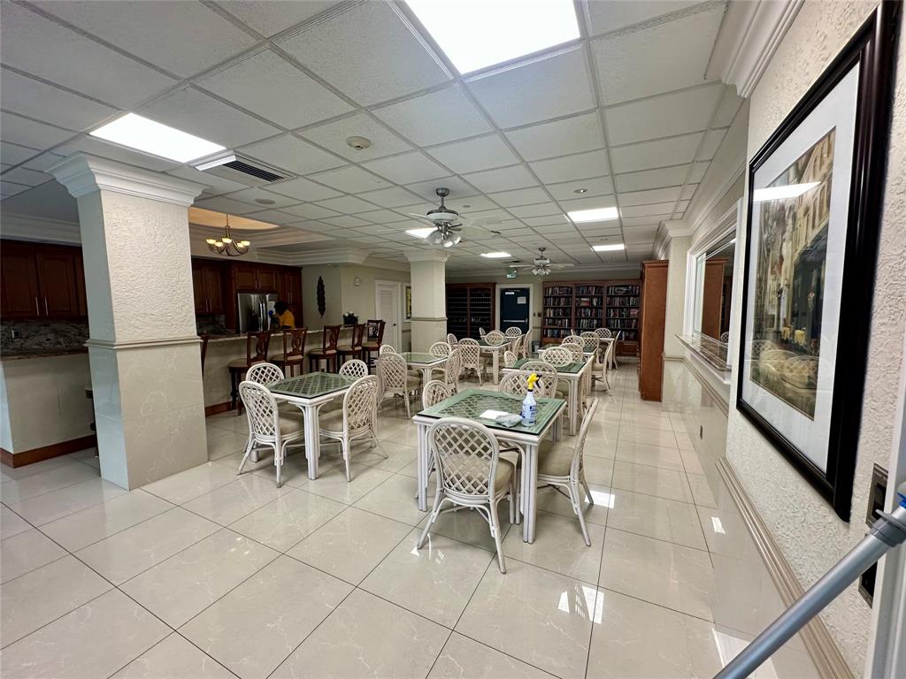 1012 North Ocean Boulevard, Unit 1206 Pompano Beach, FL 33062 - Photo 27 of 33 a room with lots of table and chairs