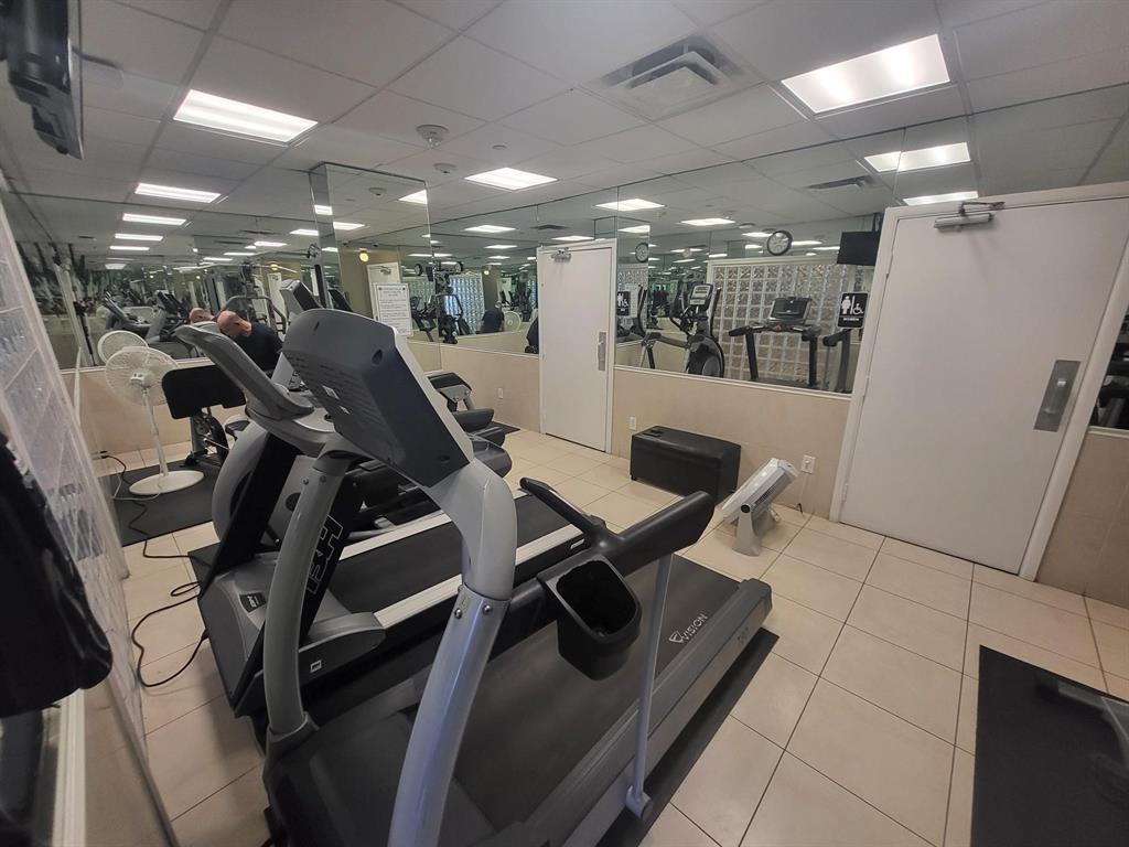 1012 North Ocean Boulevard, Unit 1206 Pompano Beach, FL 33062 - Photo 31 of 33 a view of a room with gym equipment