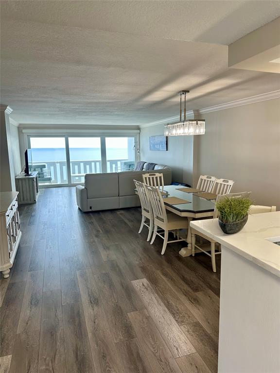 1012 North Ocean Boulevard, Unit 1206 Pompano Beach, FL 33062 - Photo 7 of 33 a dining room with furniture and wooden floor