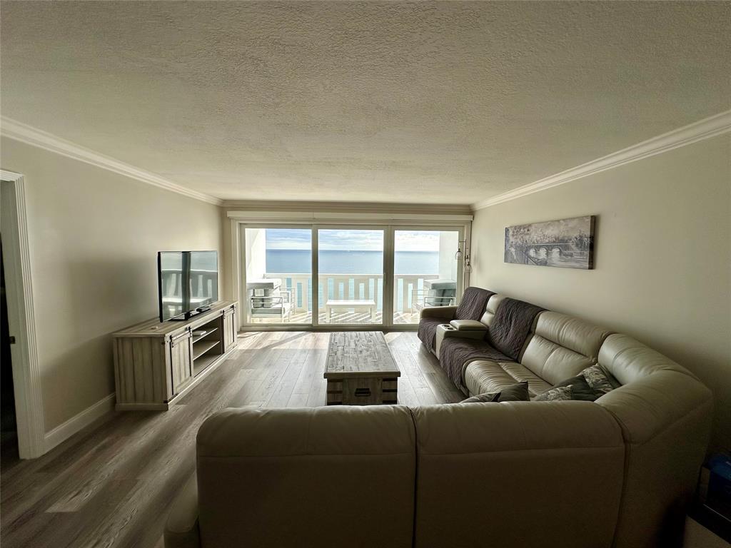 1012 North Ocean Boulevard, Unit 1206 Pompano Beach, FL 33062 - Photo 8 of 33 a living room with furniture and a large window