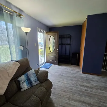 a room with furniture and a flat screen tv