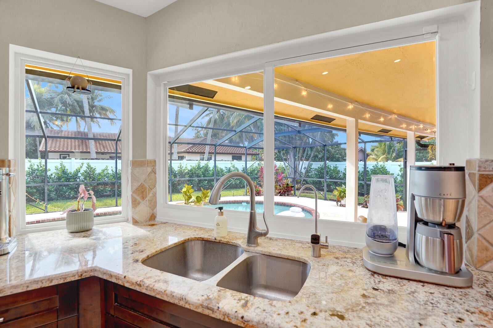 1224 Northwest 15th Street Boca Raton, FL 33486 - Photo 17 of 46 a kitchen with a sink and a large window