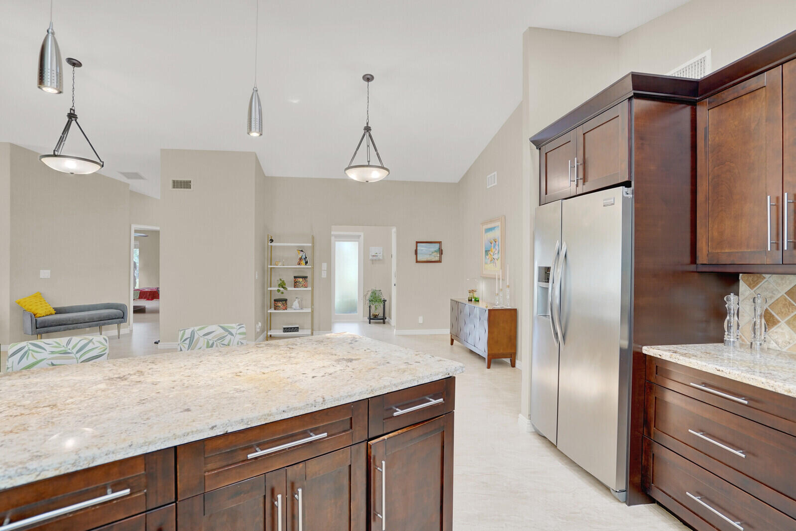 1224 Northwest 15th Street Boca Raton, FL 33486 - Photo 18 of 46 a kitchen with stainless steel appliances granite countertop a refrigerator a sink and white cabinets