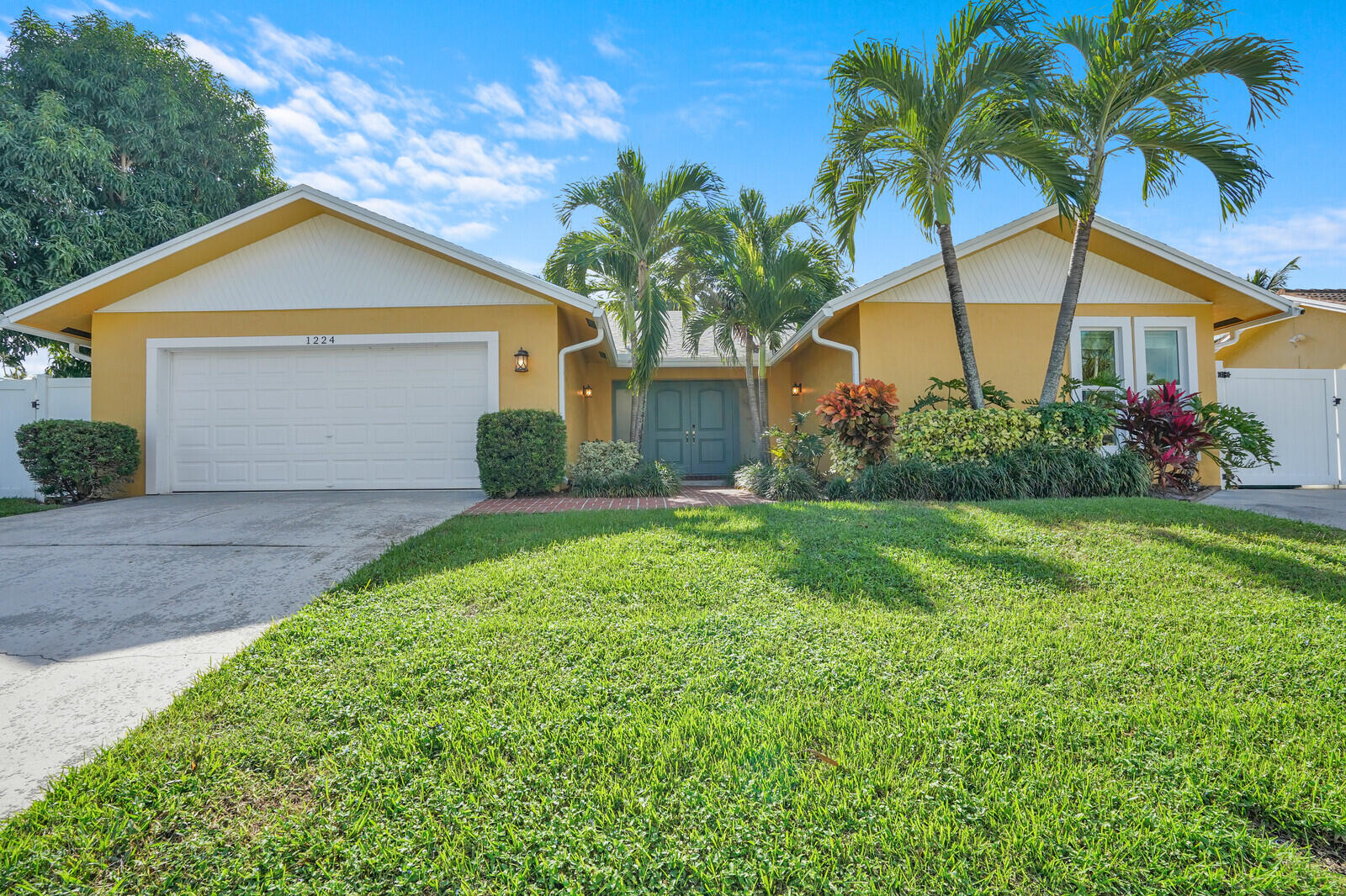 1224 Northwest 15th Street Boca Raton, FL 33486 - Photo 2 of 46 a view of house with a yard and potted plants