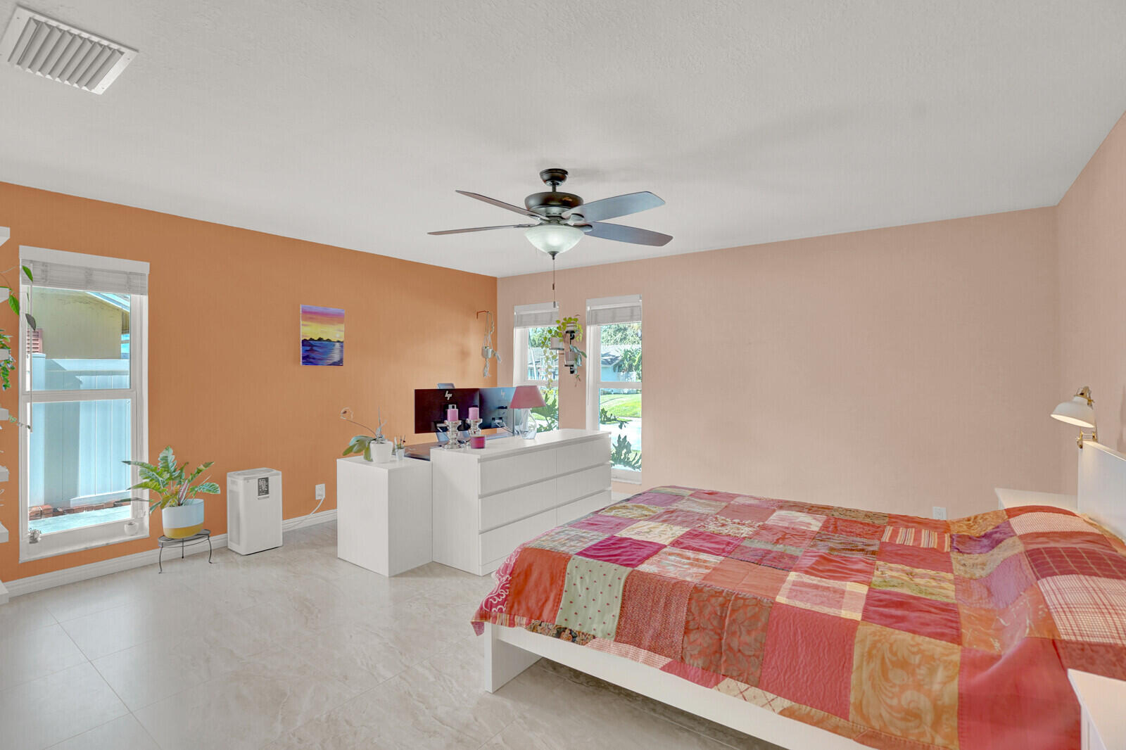1224 Northwest 15th Street Boca Raton, FL 33486 - Photo 26 of 46 a bedroom with a bed and a chandelier
