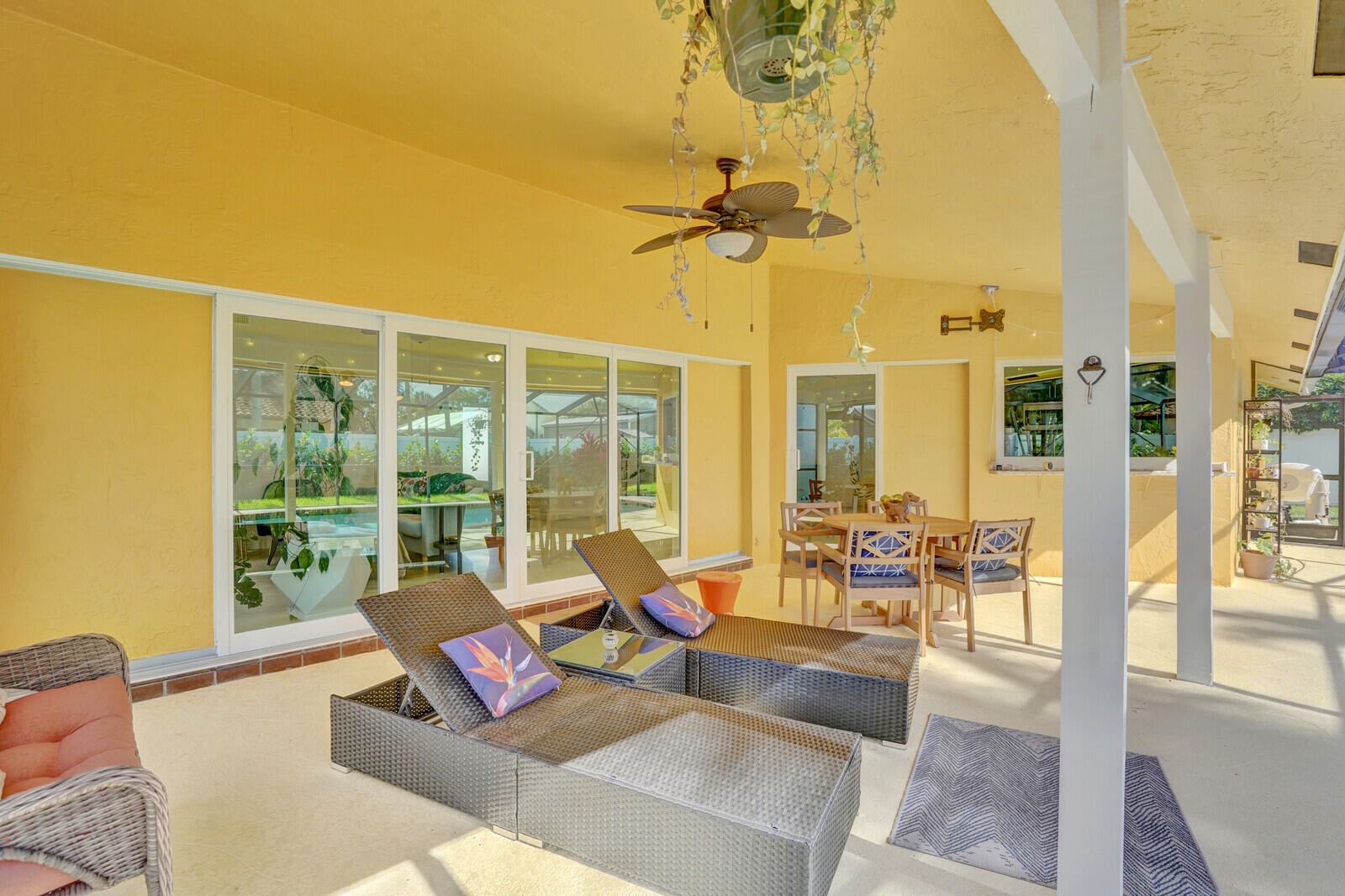 1224 Northwest 15th Street Boca Raton, FL 33486 - Photo 35 of 46 a living room with furniture and a floor to ceiling window