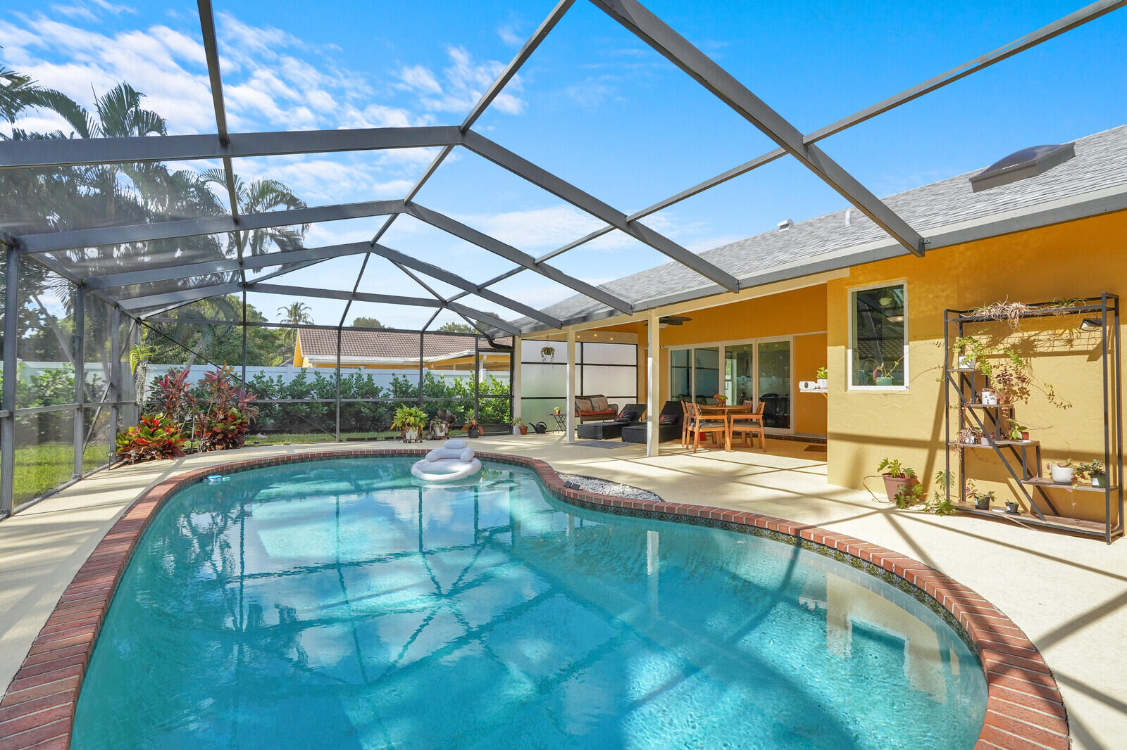 1224 Northwest 15th Street Boca Raton, FL 33486 - Photo 38 of 46 a view of a swimming pool with a patio