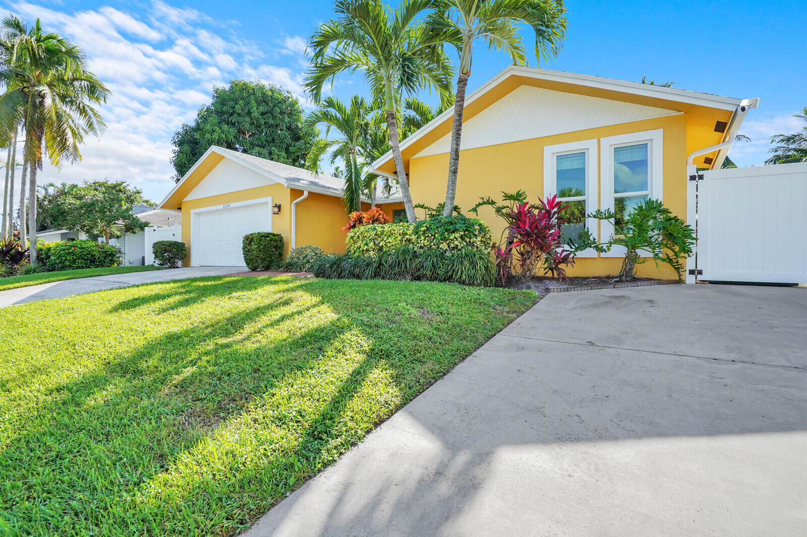 1224 Northwest 15th Street Boca Raton, FL 33486 - Photo 4 of 46 a front view of house with yard and green space