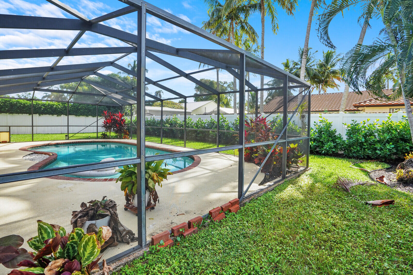 1224 Northwest 15th Street Boca Raton, FL 33486 - Photo 42 of 46 a view of a backyard with swimming pool