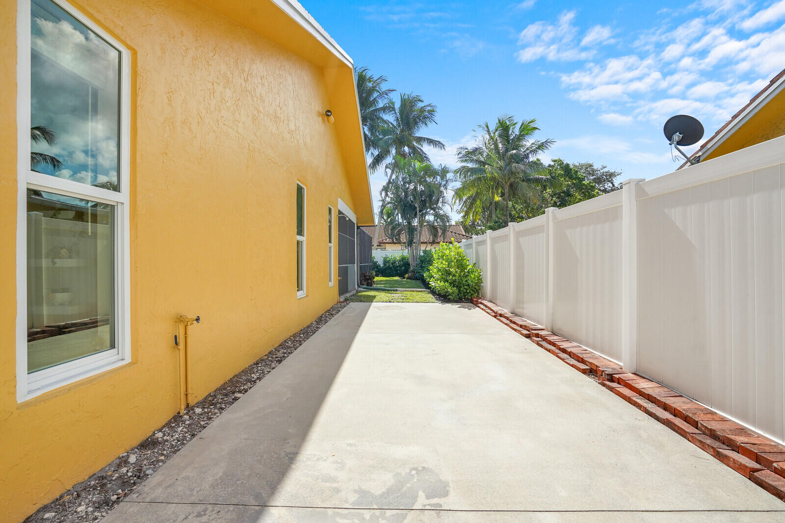 1224 Northwest 15th Street Boca Raton, FL 33486 - Photo 46 of 46 a view of a brick wall with a large window