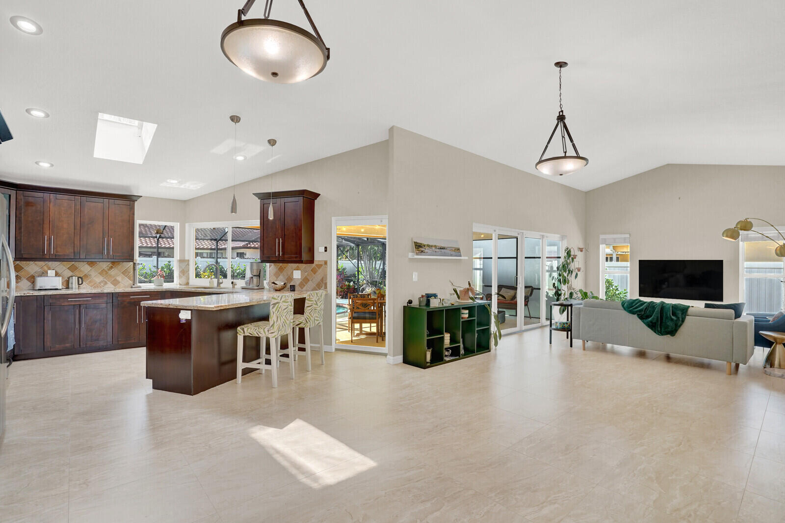 1224 Northwest 15th Street Boca Raton, FL 33486 - Photo 8 of 46 a living room with lots of furniture and kitchen view