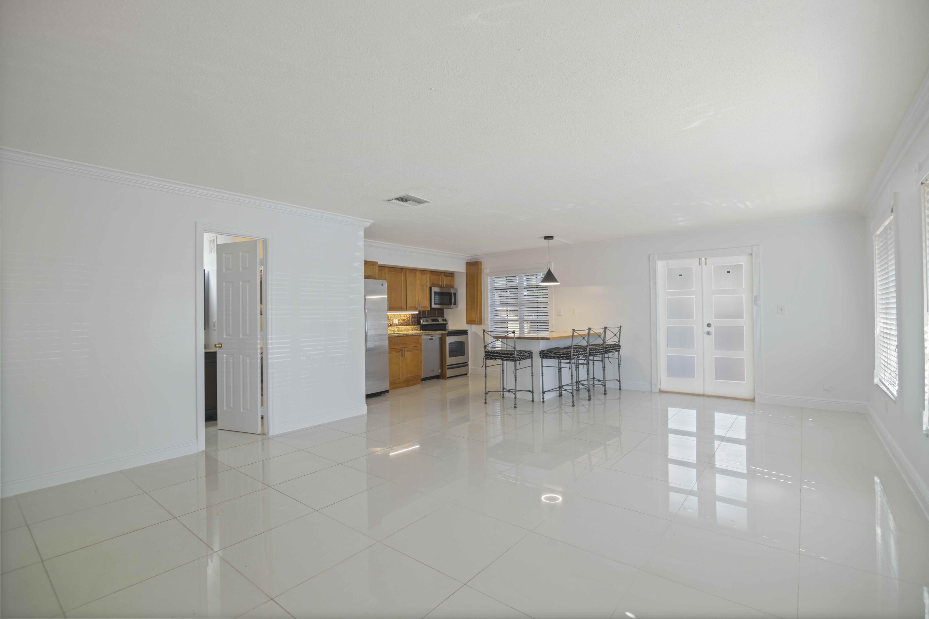 1545 Miami Road Fort Lauderdale, FL 33316 - Photo 14 of 39 a view of a livingroom with kitchen and dinning room