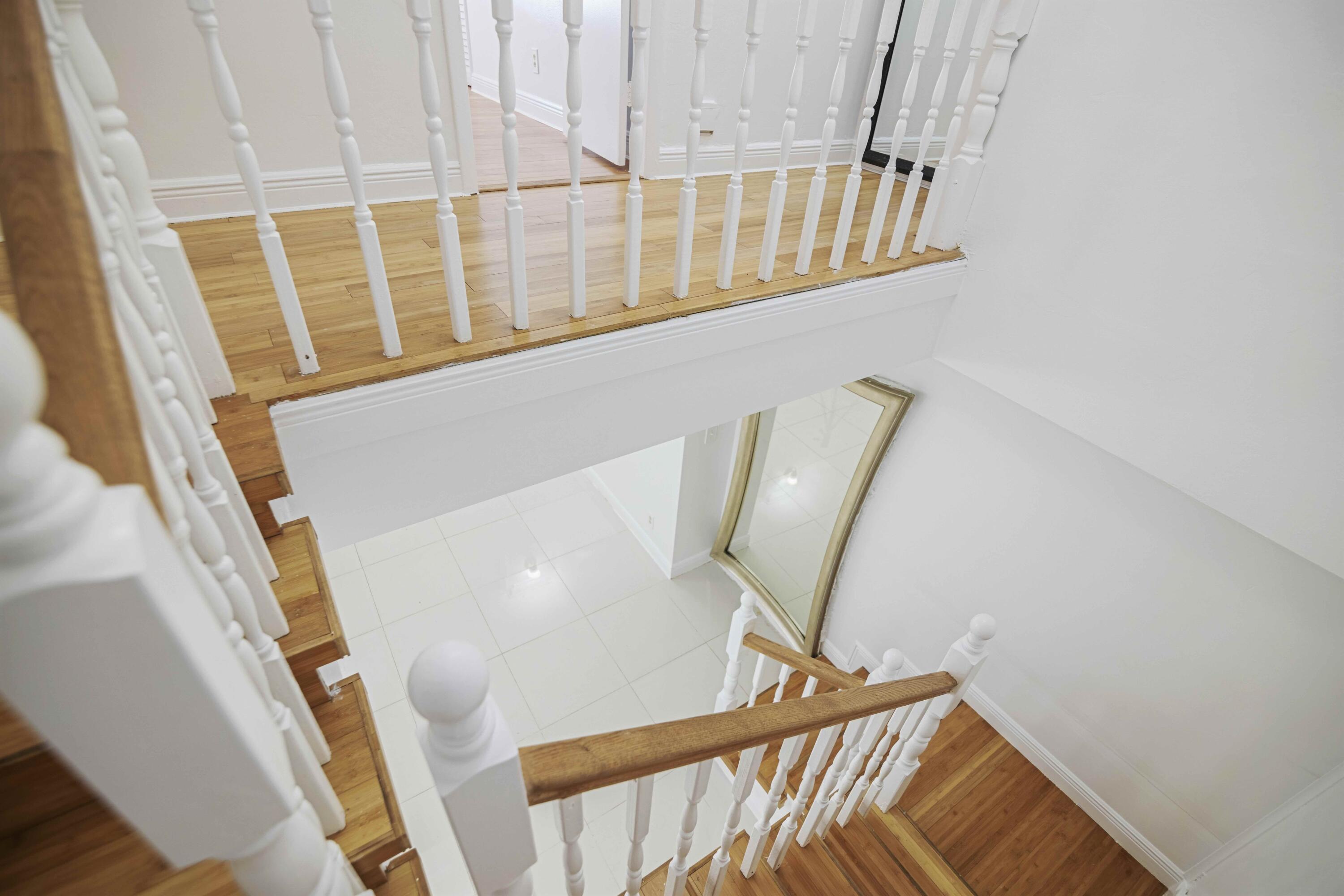 1545 Miami Road Fort Lauderdale, FL 33316 - Photo 19 of 39 a view of staircase with railing and white walls