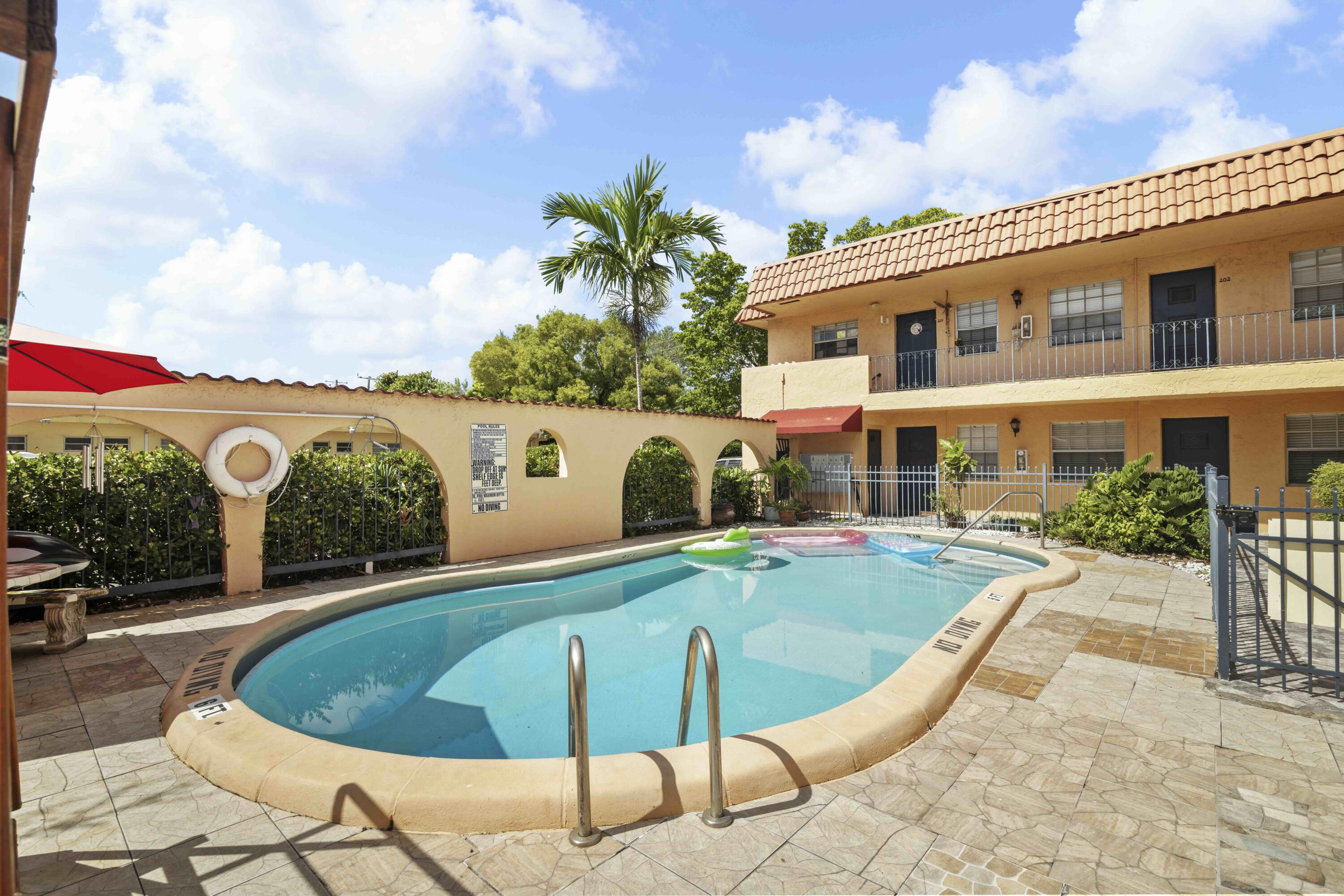 1545 Miami Road Fort Lauderdale, FL 33316 - Photo 2 of 39 a view of a swimming pool with a patio
