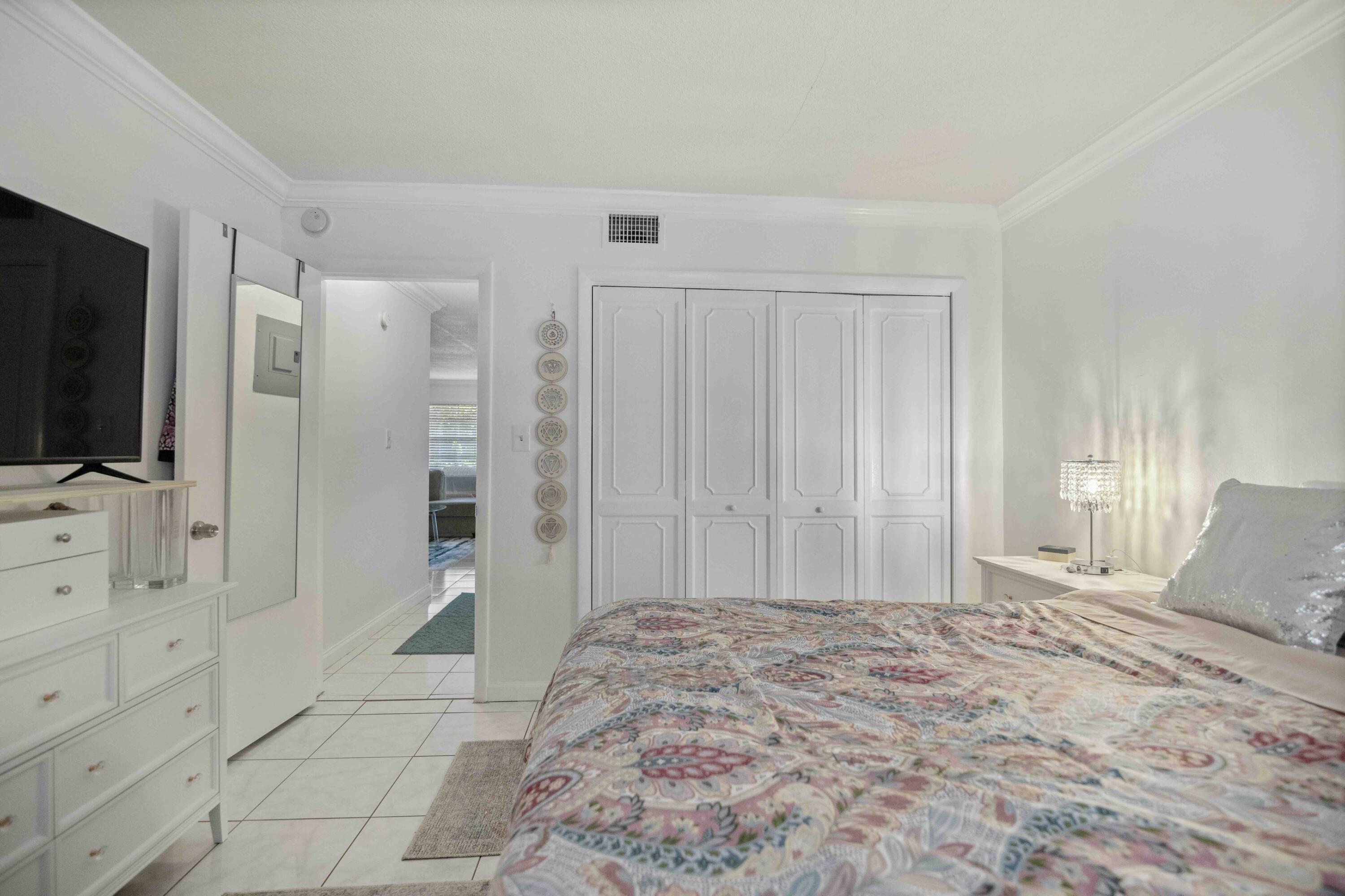 1545 Miami Road Fort Lauderdale, FL 33316 - Photo 24 of 39 a bedroom with a bed and a flat screen tv