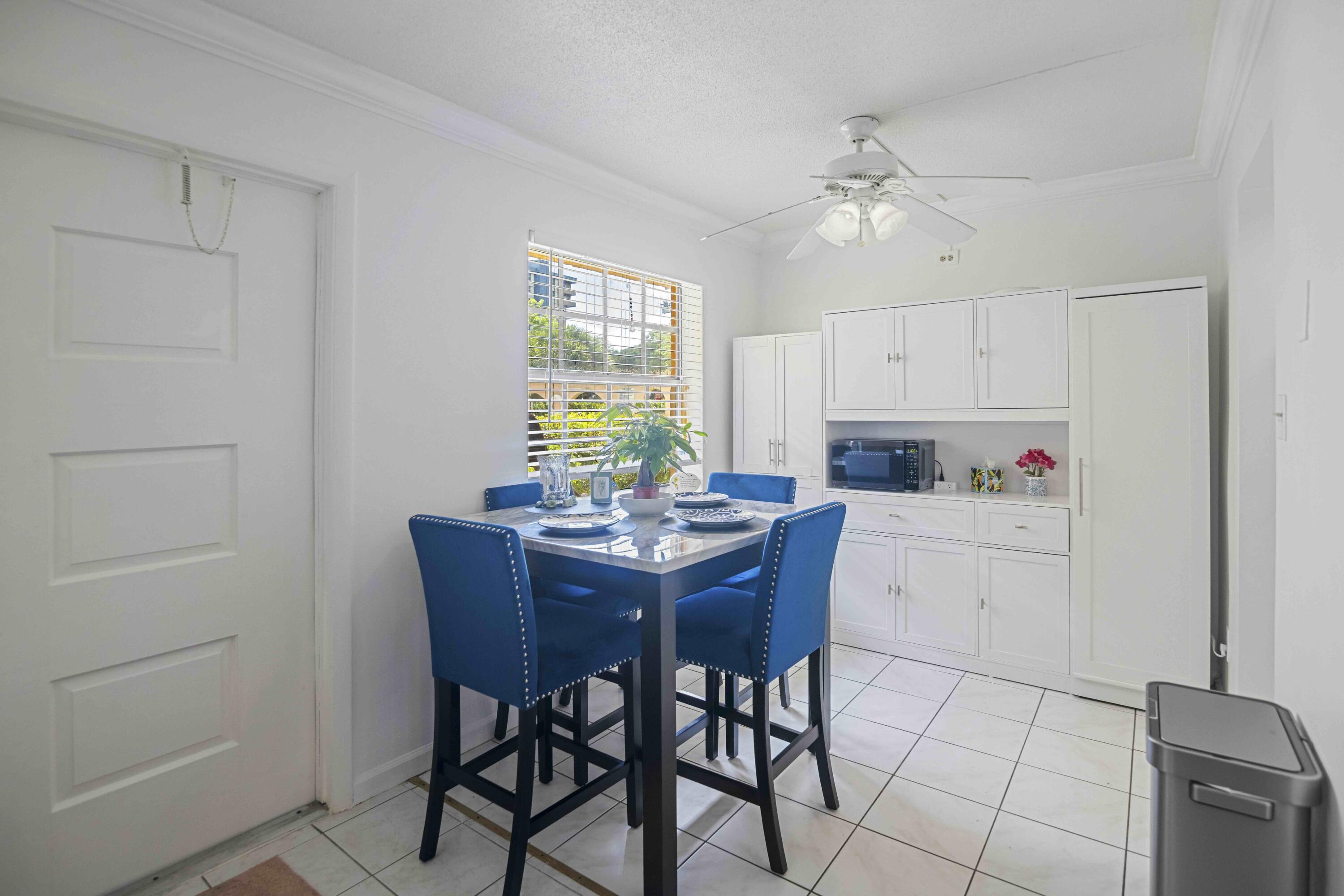 1545 Miami Road Fort Lauderdale, FL 33316 - Photo 26 of 39 a kitchen with a table and chairs