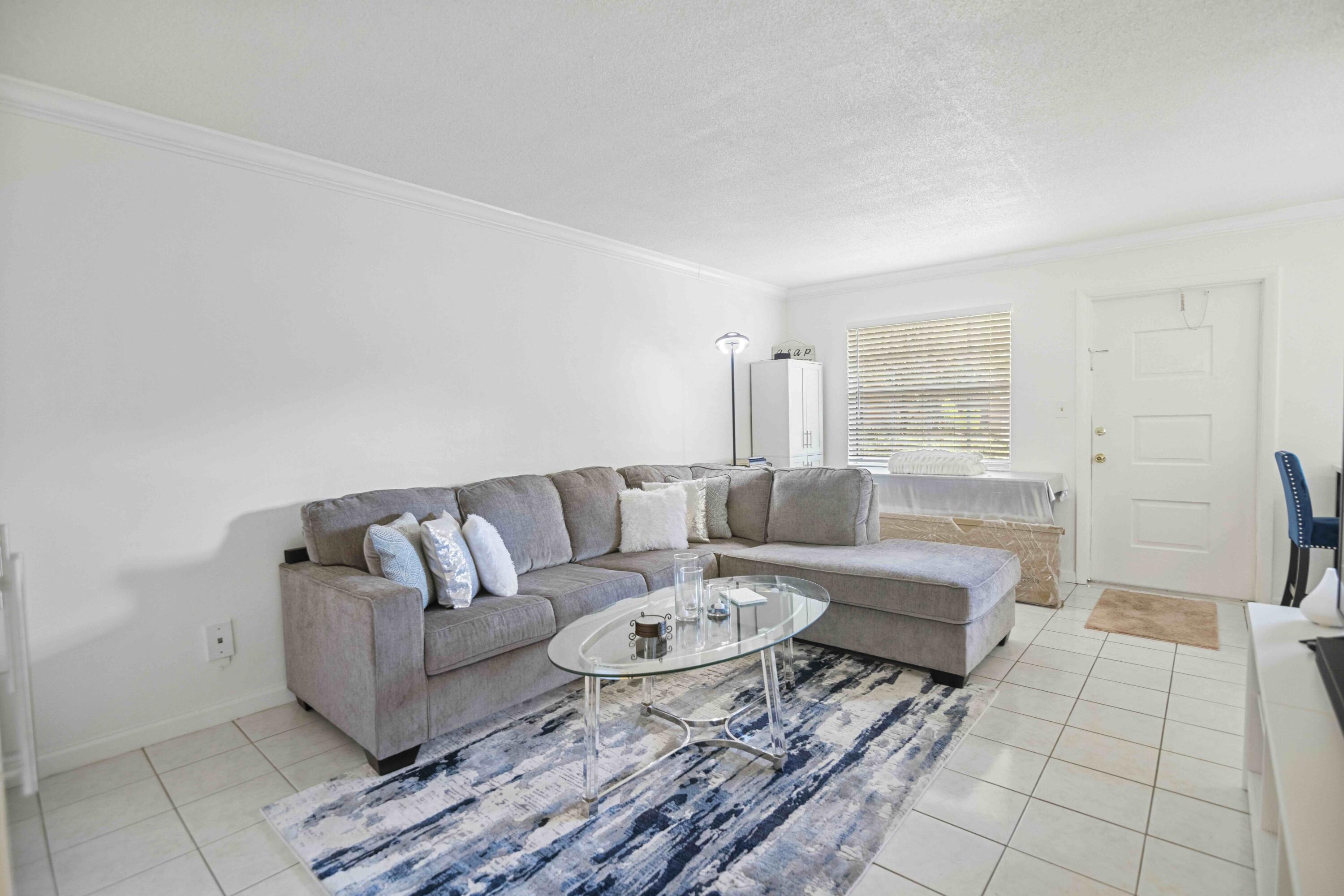1545 Miami Road Fort Lauderdale, FL 33316 - Photo 28 of 39 a living room with furniture and a rug