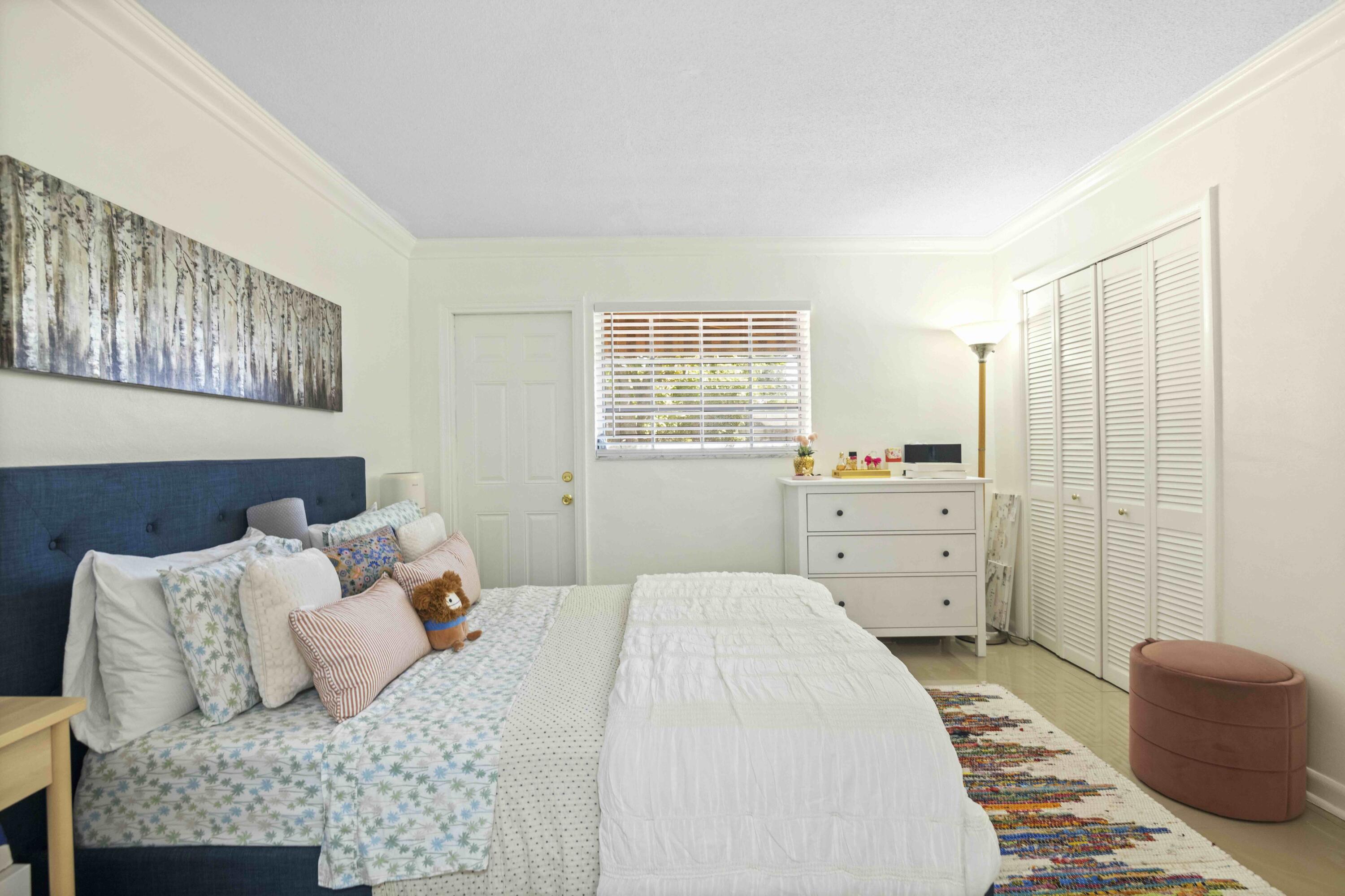 1545 Miami Road Fort Lauderdale, FL 33316 - Photo 30 of 39 a bedroom with a bed and a dresser