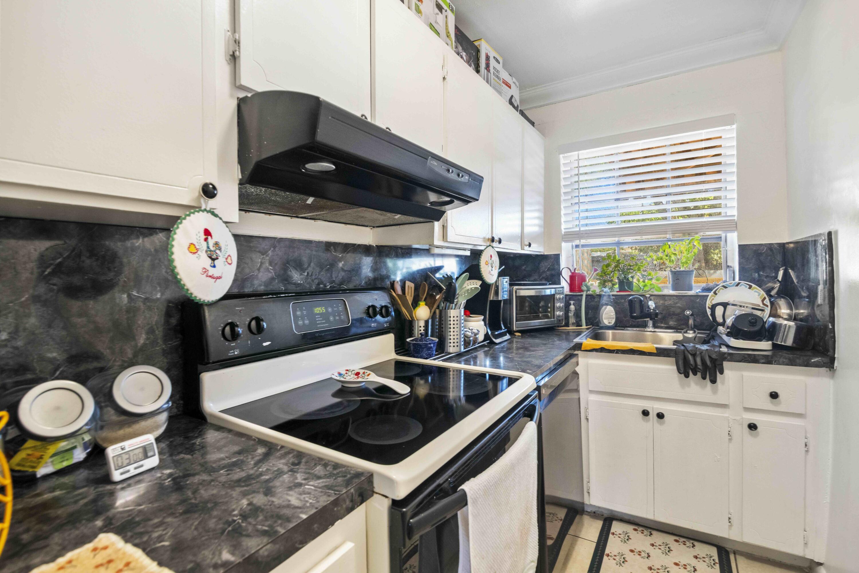 1545 Miami Road Fort Lauderdale, FL 33316 - Photo 31 of 39 a kitchen with a stove and a sink