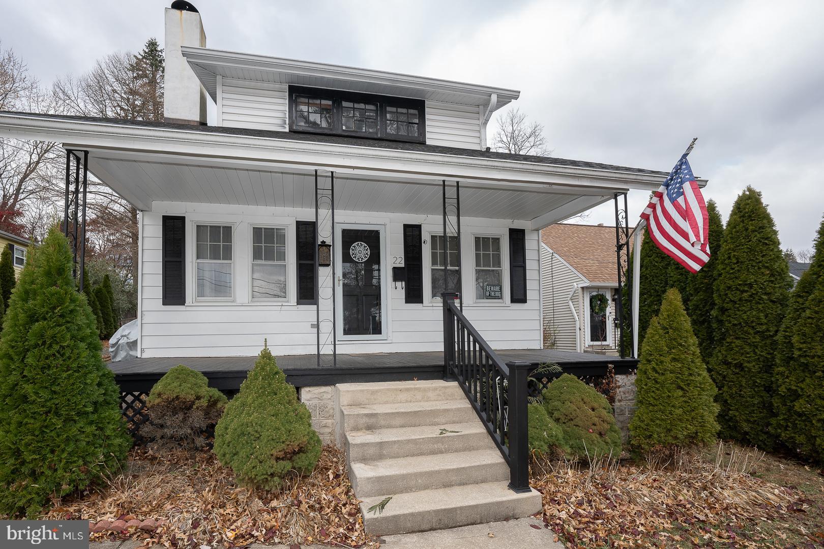 22 Delmont Road Newtown Square, PA 19073 - Photo 1 of 35 a front view of a house with a yard and potted plants