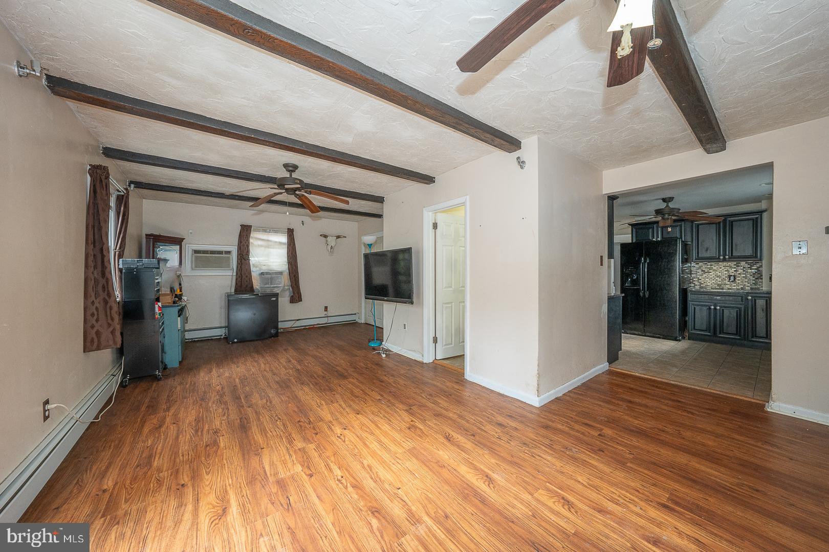 22 Delmont Road Newtown Square, PA 19073 - Photo 19 of 35 a view of a hallway with wooden floor and living room