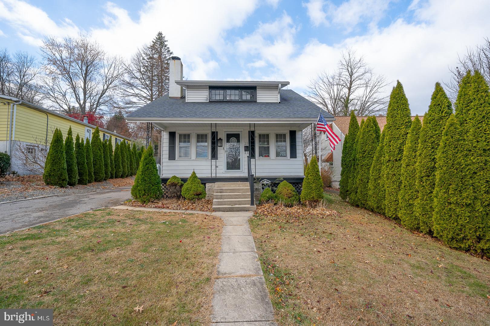 22 Delmont Road Newtown Square, PA 19073 - Photo 3 of 35 a view of a house with a small yard and plants