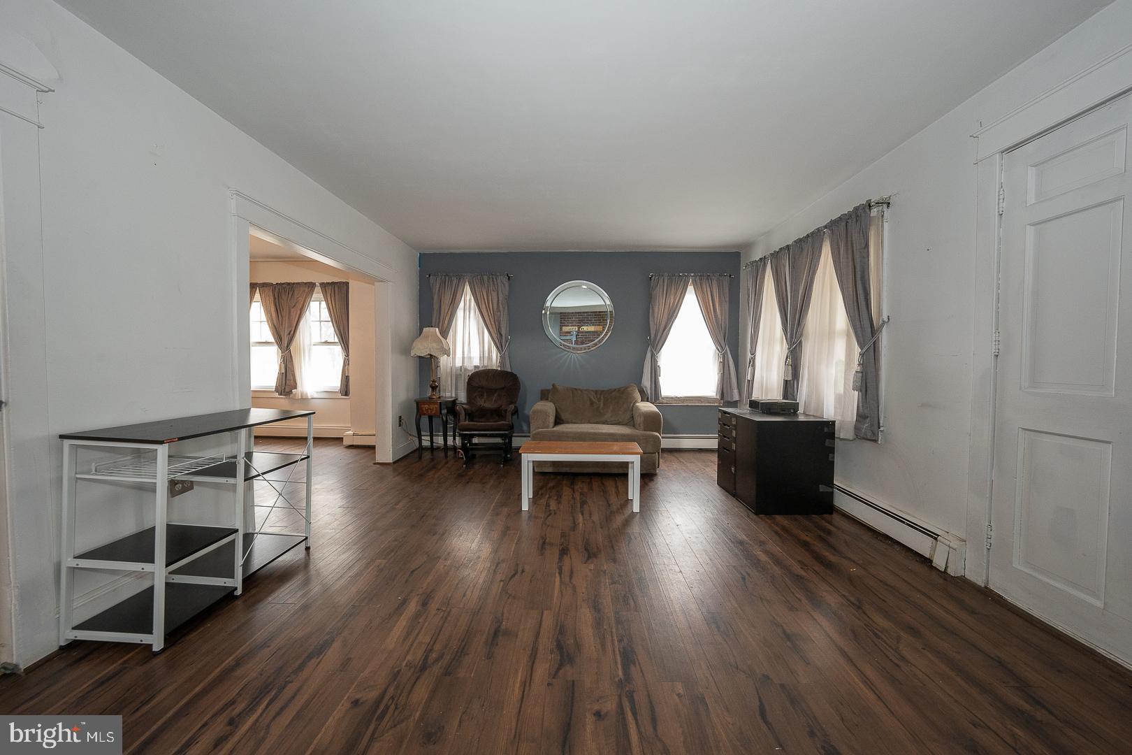 22 Delmont Road Newtown Square, PA 19073 - Photo 8 of 35 a living room with furniture and a wooden floor