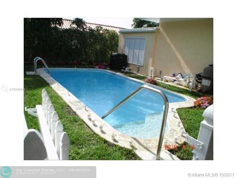9324 Abbott Avenue Surfside, FL 33154 - Photo 18 of 33 a view of a backyard with sitting area